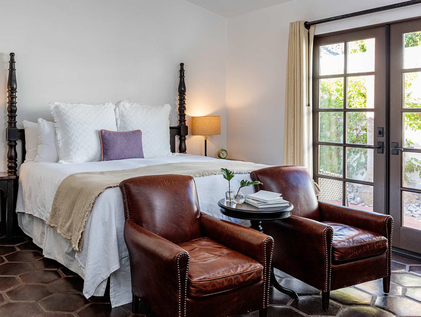 melvyn's suite king bed with access to private patio