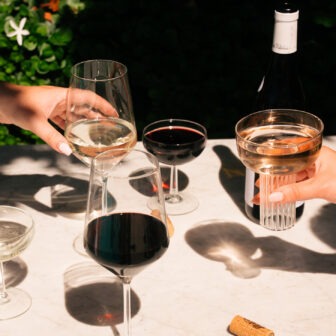 Various wines, each in a distinct glass, are arranged on the table.